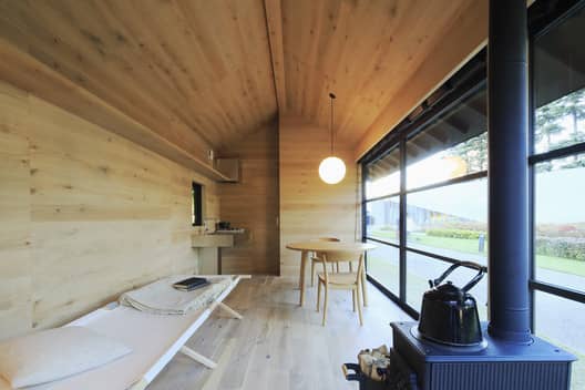 A wooden hut by Naoto Fukasawa. Image Courtesy of MUJI